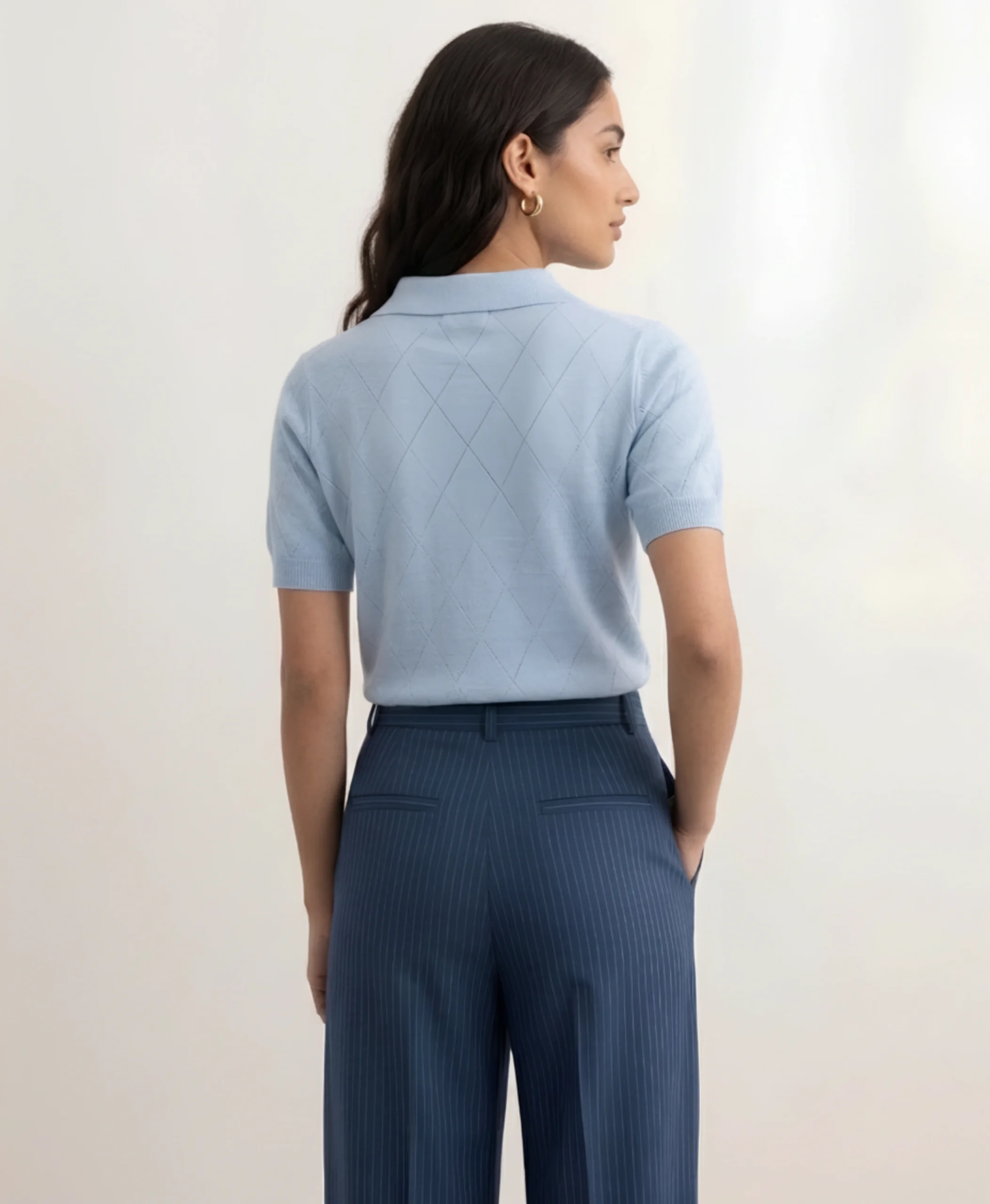 Back view of women's powder blue pointelle polo.webp