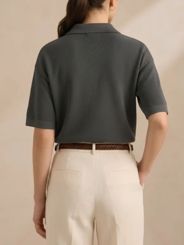 Back view of women's charcoal polo in textured knit.webp