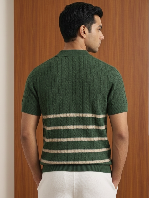 Back view of Orphic men's forest green cable-knit polo with ivory stripes, worn by model