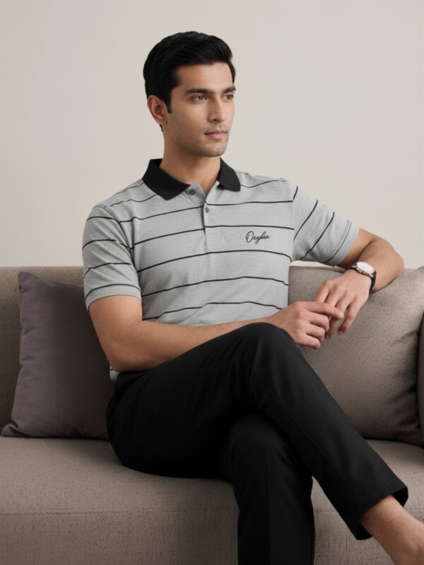 Orphic men's grey and black striped polo shown on seated model