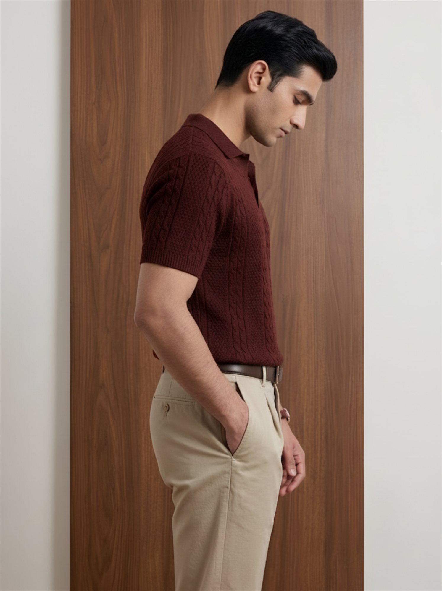 Side view of Orphic men's maroon cable-knit polo styled with khaki trousers