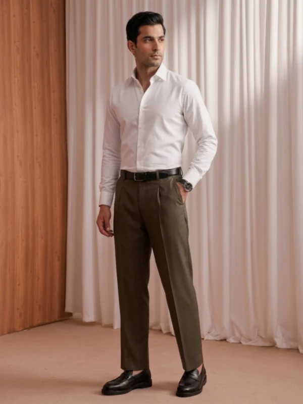 Men's olive pleated trousers styled with a white shirt, full-length view