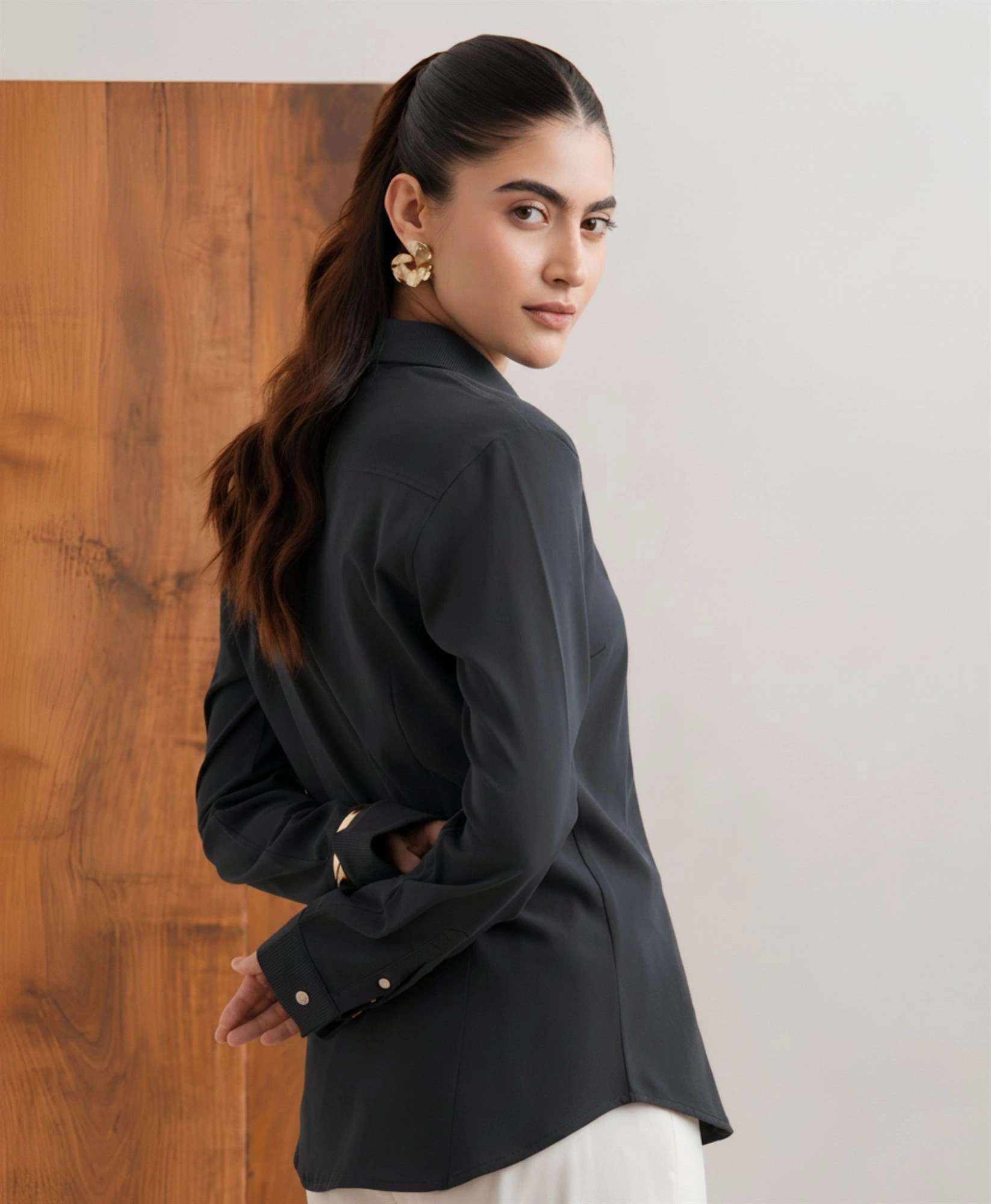 Women's charcoal knit shirt side and back detail with ribbed cuffs