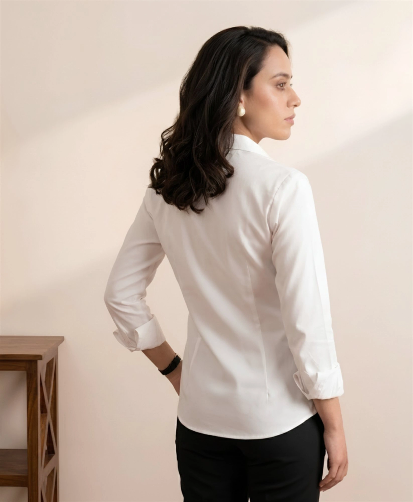 Women's white shirt back view showing tailored fit